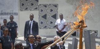Rwandan first lady Jeannette Kagame and European Commission President Jean-Claude Juncker light the flame of remembrance at the Kigali Genocide