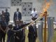 Rwandan first lady Jeannette Kagame and European Commission President Jean-Claude Juncker light the flame of remembrance at the Kigali Genocide